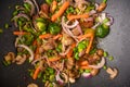 Wok, close-up, shredding meat with vegetables.Tasty food, culinary background, gastronomy