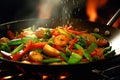 A wok cooking fresh stir fry vegetables
