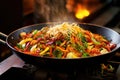 wok filled with colorful stir-fry vegetables on a stove