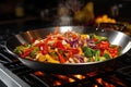 wok filled with colorful stir-fry vegetables on a stove