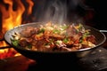 wok on fire, charring marinated meat chunks Royalty Free Stock Photo