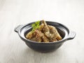 Wok-fried Prawns with Salt and Pepper with chopsticks served in a pot isolated on mat side view on grey background Royalty Free Stock Photo