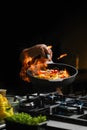 Wok ingredients - shrimp, tomatoes, pepper, onion and spice in a frying pan Royalty Free Stock Photo