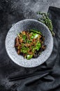 Wok. Soba stir fry noodles with beef and vegetables. Black background. Top view Royalty Free Stock Photo