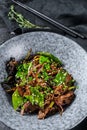 Wok. Soba stir fry noodles with beef and vegetables. Black background. Top view Royalty Free Stock Photo