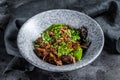 Wok. Soba stir fry noodles with beef and vegetables. Black background. Top view Royalty Free Stock Photo