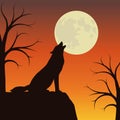 Wolf howls at the full moon orange and brown landscape Royalty Free Stock Photo