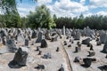 Lots of stones symbolising gravestones. Inscriptions indicate places of Holocaust train departures
