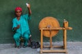 WOLLEKA, ETHIOPIA - MARCH 14, 2019: Local woman spinning thread using spindle in Ploughshare Women's workshop in