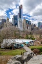 Wollman Rink with People Ice Skating during winter, rocks in forefront, NYC