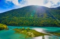 Wolong Bay of Kanas Lake. Crystal blue river, small sandbar.Green tree hills Royalty Free Stock Photo