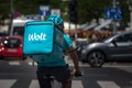 Wolt delivery man driving in belgrade with his . Royalty Free Stock Photo