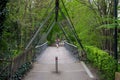 Woluwe-Saint-Lambert, Brussels Capital Region, Belgium - Pending bridge at an old train high line, now a city park