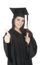 Caucasian woman wearing in a black graduation gown Royalty Free Stock Photo