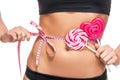 Woman abdomen with measuring tape