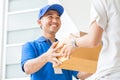 Woman accepting a delivery boxes from deliveryman Royalty Free Stock Photo