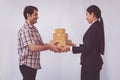 Woman accepting receive a delivery of boxes from delivery asian man Royalty Free Stock Photo