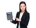 Woman accountant with finger point to calculator