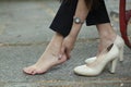 Woman ache feet in high shoes