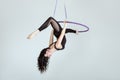 Woman is an acrobat in a hula hoopa. Royalty Free Stock Photo