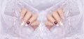 Fashionista woman acrylic fingernail painting beautiful white color gel nail art decorated with cute 3D rose flower sparkling