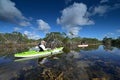Woman and active senior kayaking on Nine Mile Pond in Everglades National Park. Royalty Free Stock Photo