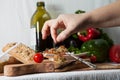 Woman is adding a pinch of salt on the delicious eggplant salad Royalty Free Stock Photo