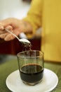 Woman adding sweetener in coffee Royalty Free Stock Photo