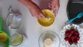 The woman adds vanillin to the dough and mixes. Next to the table are ingredients for pie.