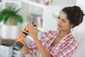 woman adjusting cordless drill