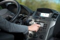 Woman adjusting a knob in her car Royalty Free Stock Photo