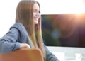 Woman administrator sitting at the workplace