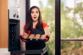 Woman Admiring her Delicious Cupcake fresh of the Oven