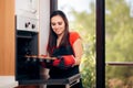 Woman Admiring her Delicious Cupcake fresh of the Oven