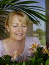 Woman Admiring New Blooms