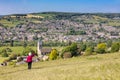 Woman admiring view across to Stroud from Selsley Common, The Cotswolds, Gloucestershire, England Royalty Free Stock Photo