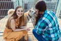 Woman adopting a dog in the animal shelter, eagerly waiting Royalty Free Stock Photo