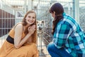 Woman adopting a dog in the animal shelter, eagerly waiting Royalty Free Stock Photo