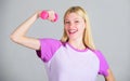 Woman adorable blonde exercising with dumbbell. Easy exercises with dumbbell. Workout with dumbbell. Biceps exercises Royalty Free Stock Photo