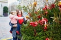 Woman and adorable toddler girl on Christmas market in Paris, France Royalty Free Stock Photo