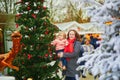 Woman and adorable toddler girl on Christmas market in Paris, France Royalty Free Stock Photo