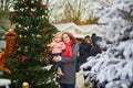 Woman and adorable toddler girl on Christmas market in Paris, France Royalty Free Stock Photo