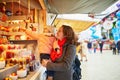 Woman and adorable toddler girl on Christmas market in Paris, France Royalty Free Stock Photo