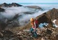 Woman adventurer hiking in mountains with backpack travel outdoor