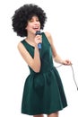 Woman with afro hairstyle doing karaoke Royalty Free Stock Photo