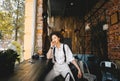 Woman with afro hairstyle, who is sitting in the coffee shop and looking out the window Royalty Free Stock Photo