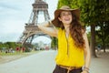 Woman against clear view of Eiffel Tower enjoying promenade Royalty Free Stock Photo