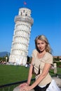 Woman against a falling tower in Pisa Royalty Free Stock Photo