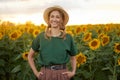 Woman agronomist standing agricultural sunflower field Caucasian female farmer straw hat Portrait agribusiness worker Royalty Free Stock Photo