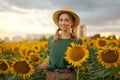 Woman agronomist standing agricultural sunflower field Caucasian female farmer straw hat Portrait agribusiness worker Royalty Free Stock Photo